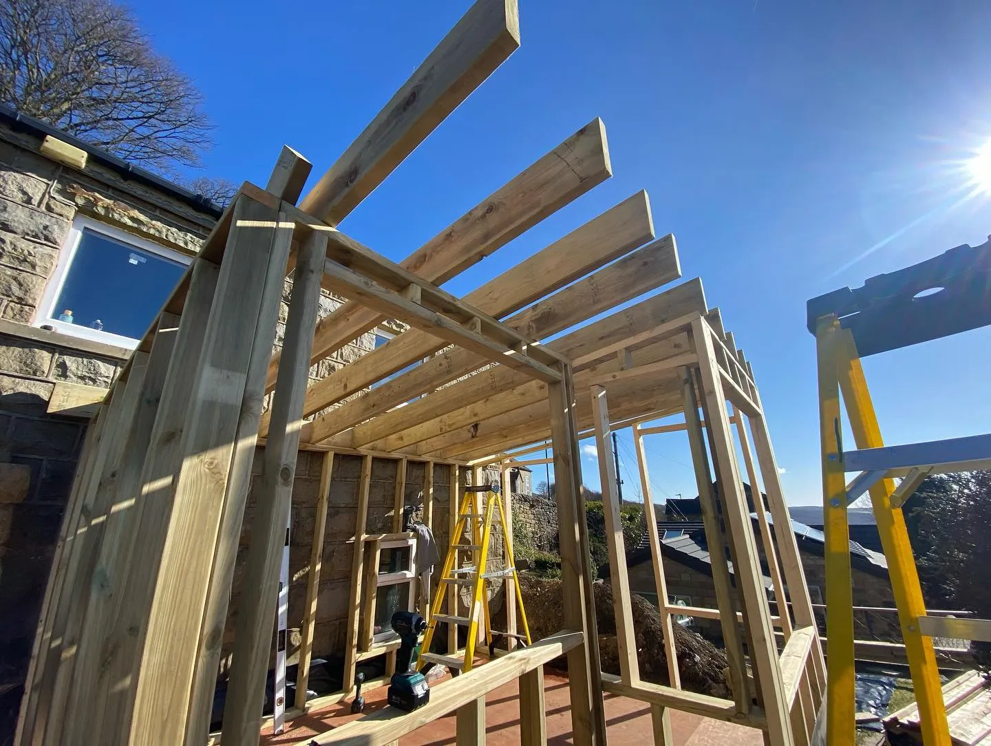 Photorealistic installation of a garden room by local builders in a Nottingham garden