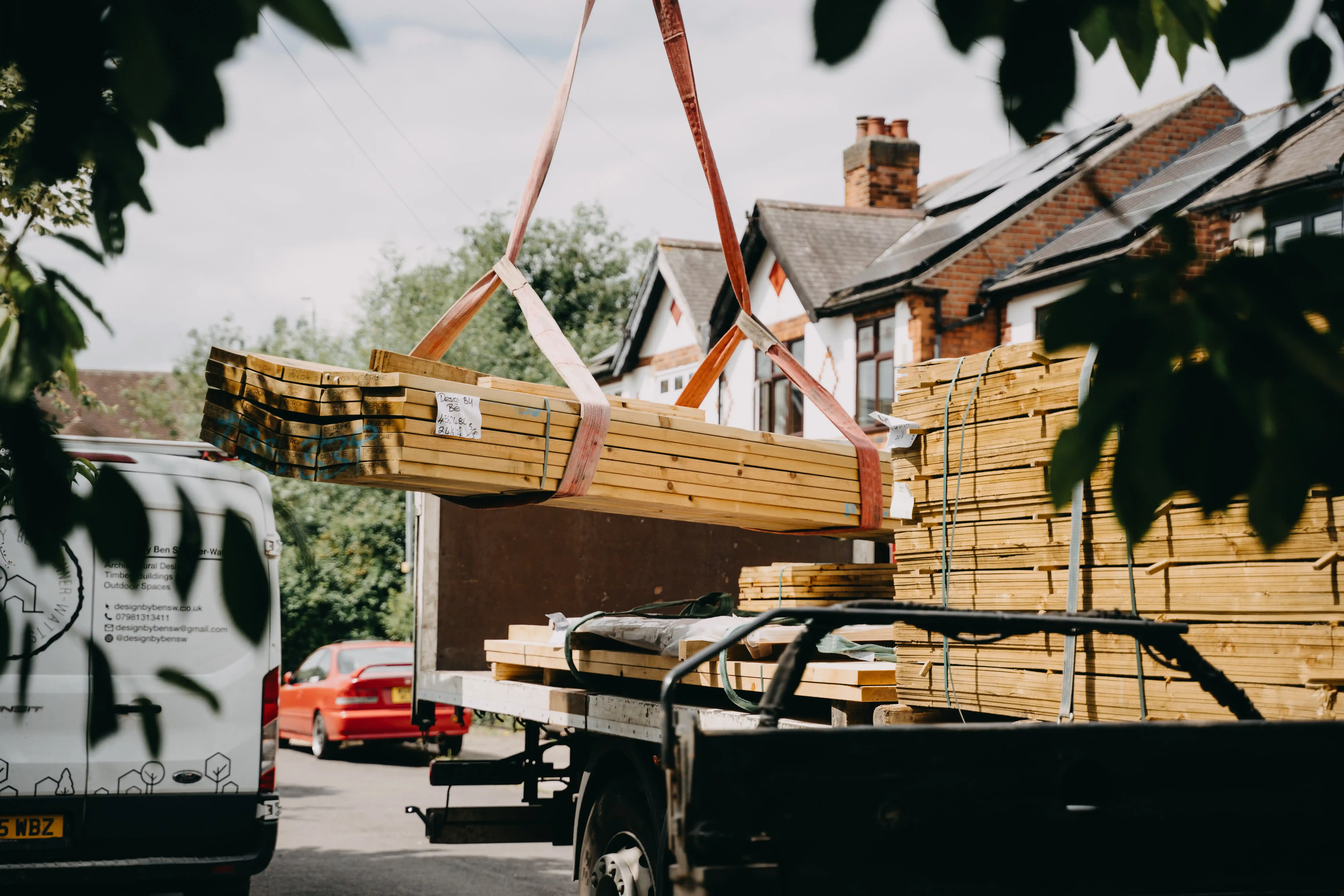 Photorealistic builders constructing a timber-framed garden room in a suburban garden