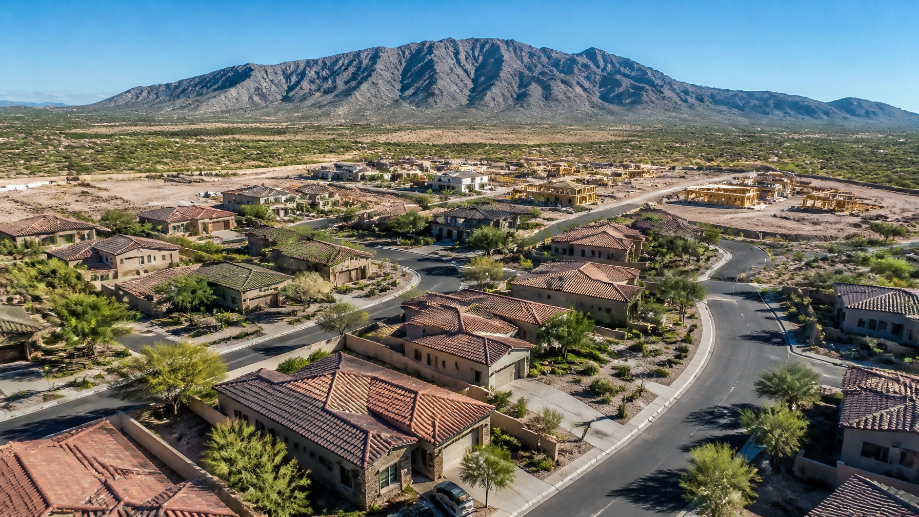 Aerial view of homes and new construction in the Buckeye Arizona real estate market.
