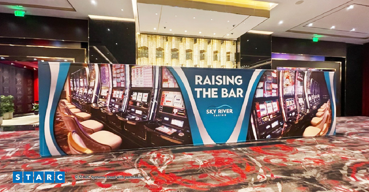 Branded STARC StackBarrier wall on a casino gaming floor at Sky River Casino