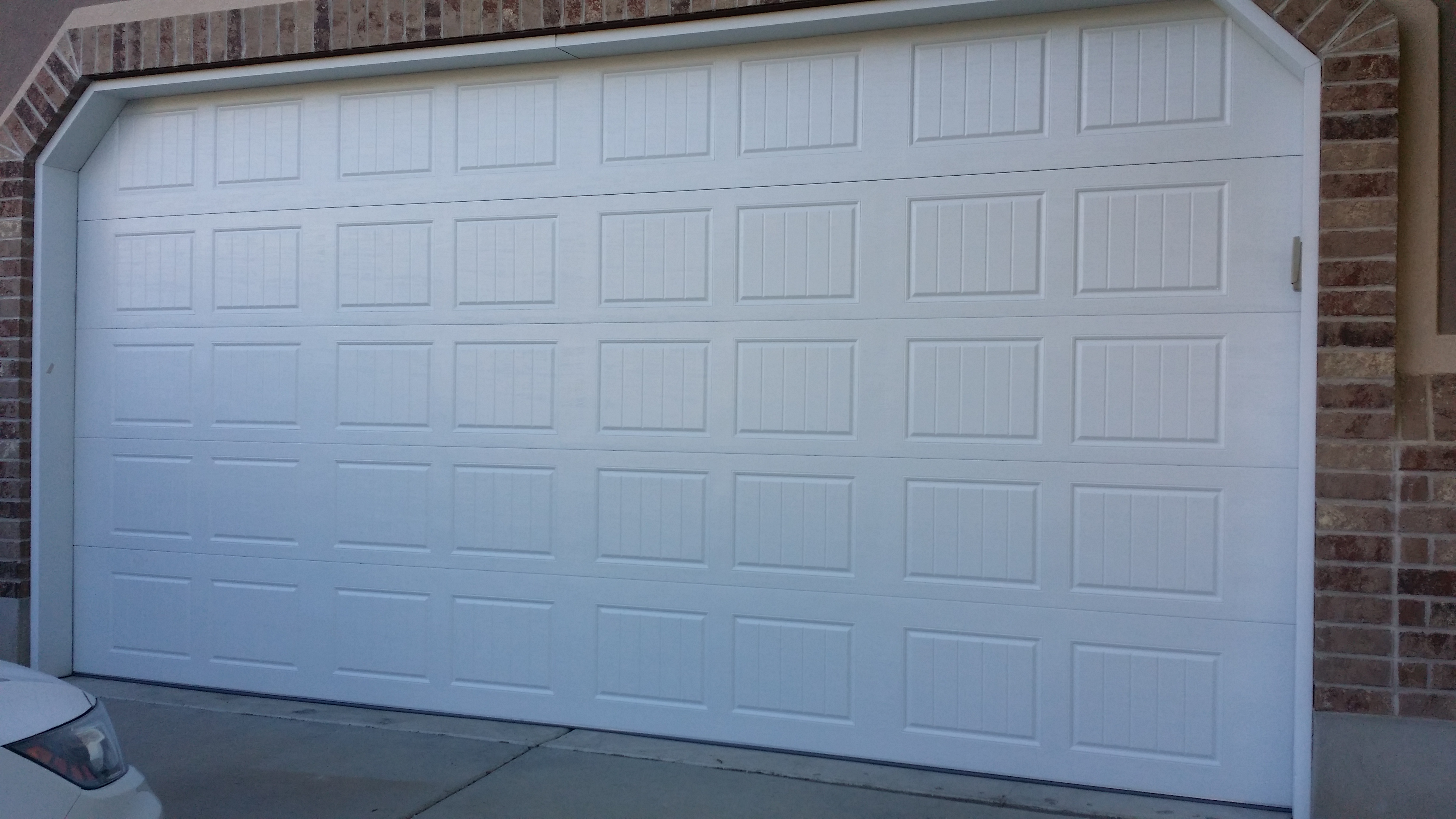 Before and after carriage house garage door in Cedar Hills, Utah