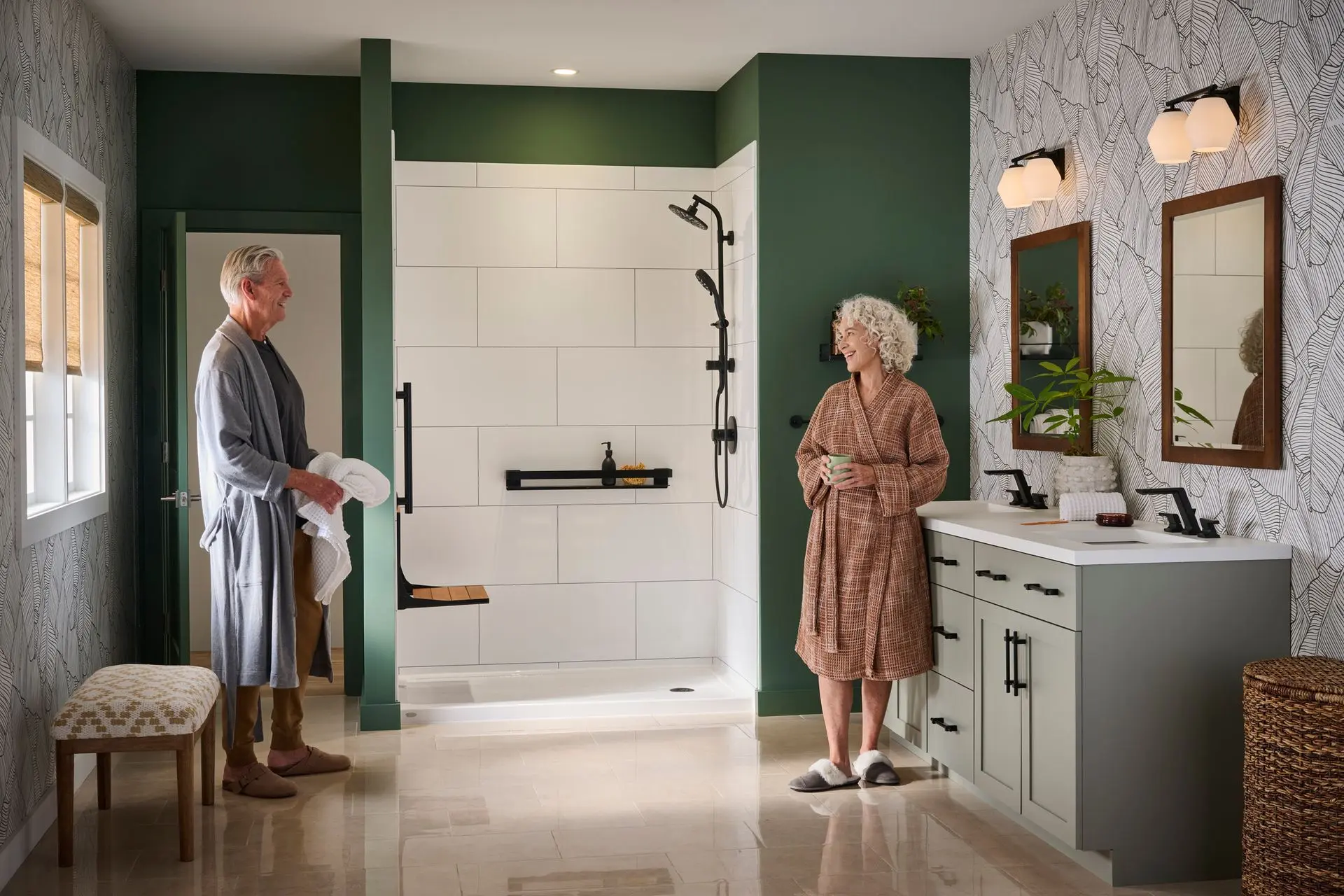 Homeowners in their remodeled bathroom with a walk-in shower, grab bar and fold-down seat