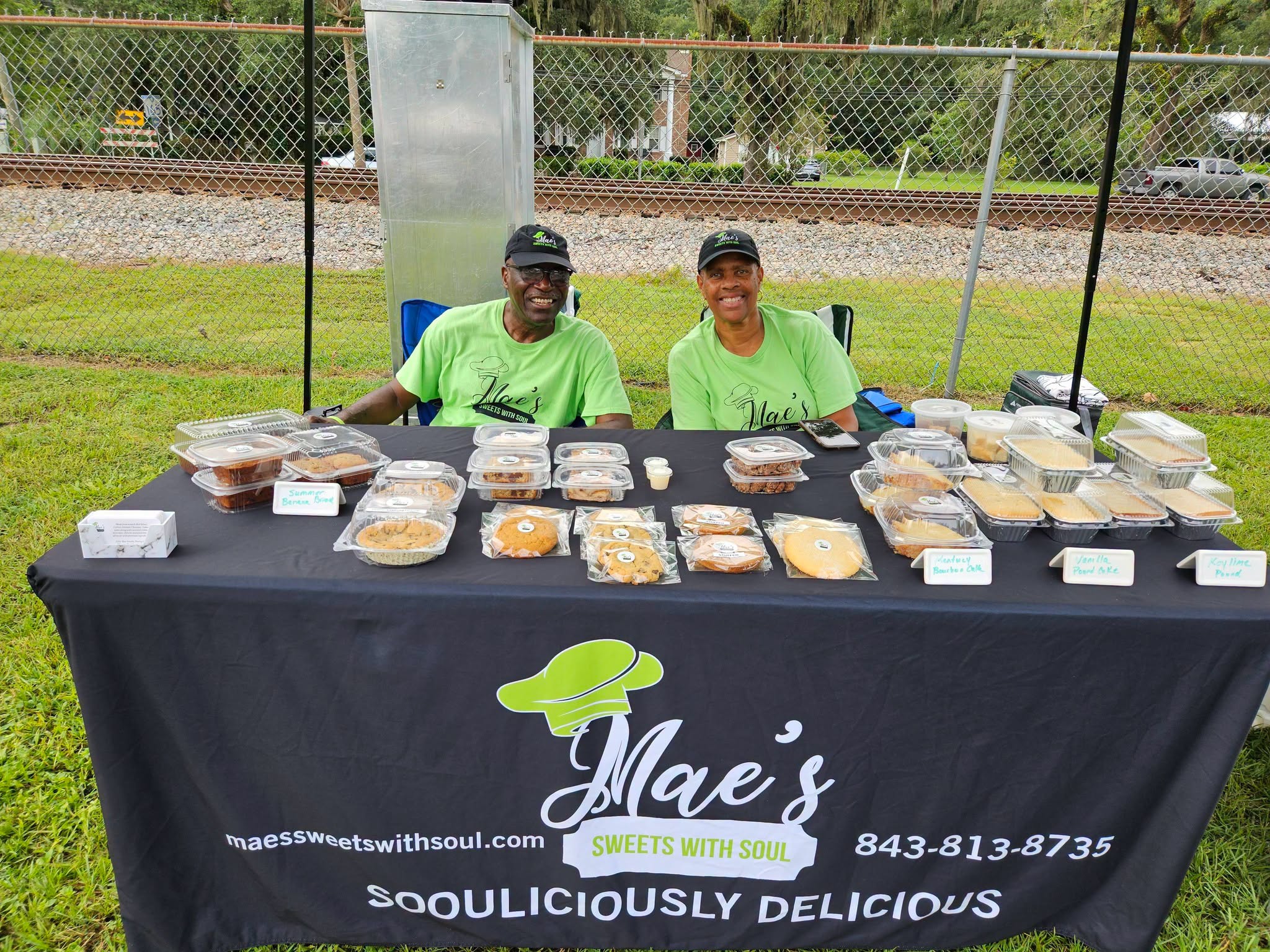 Lillie and Carl behind the Mae’s Sweets with Soul market table