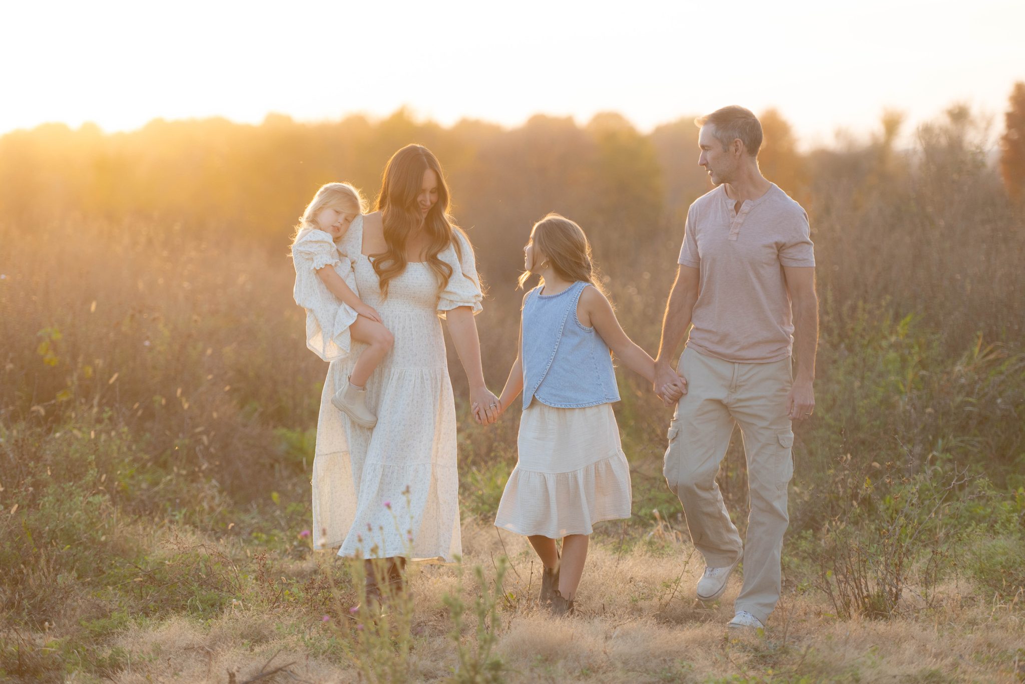 Family playing in field