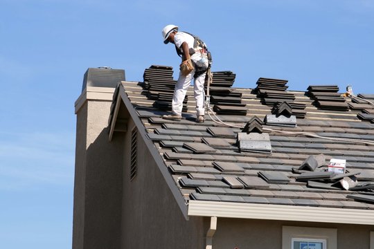 Roofing contractor at work