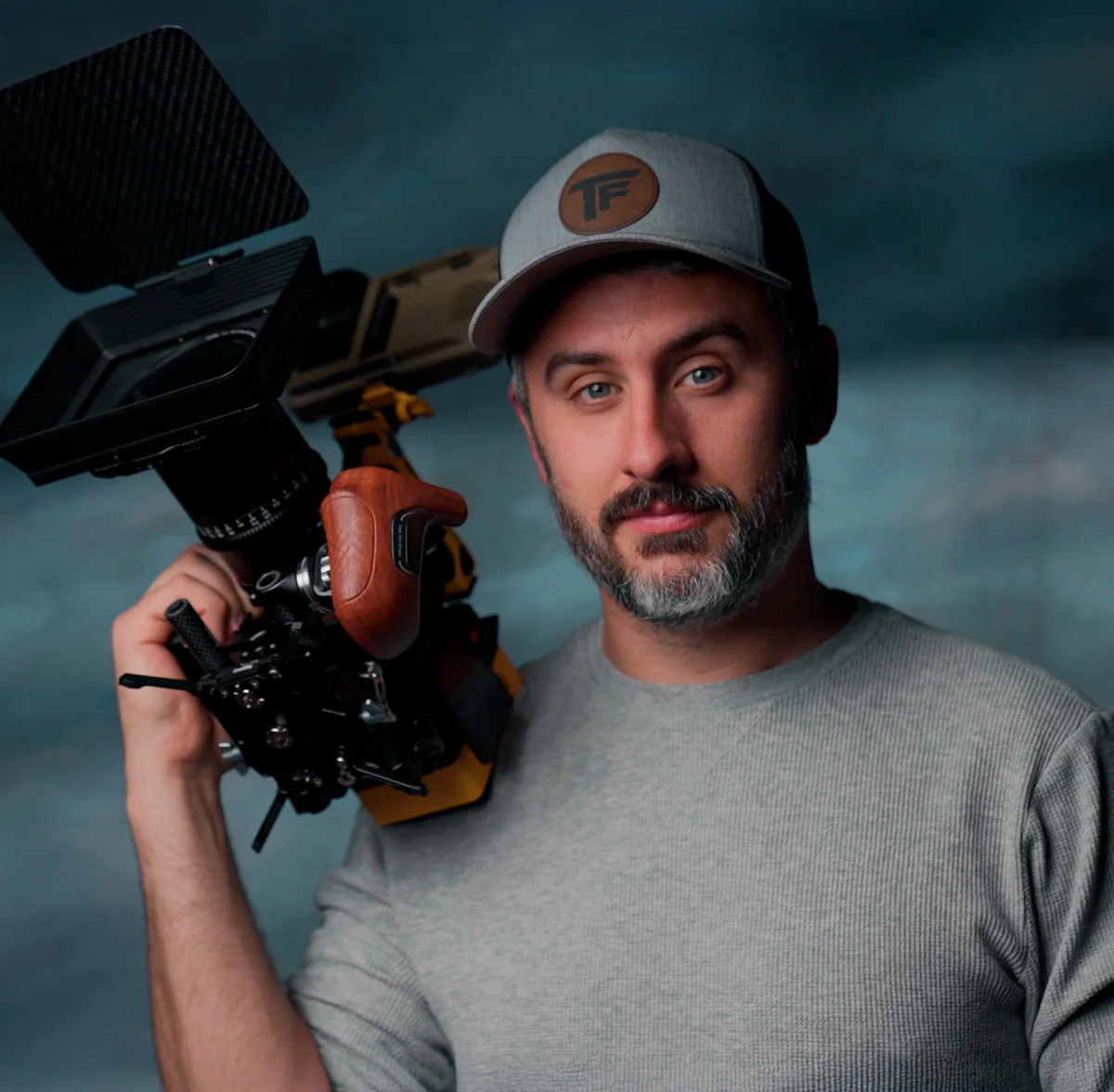 Justus McCranie, founder of Master YouTube, holding a cinema camera
