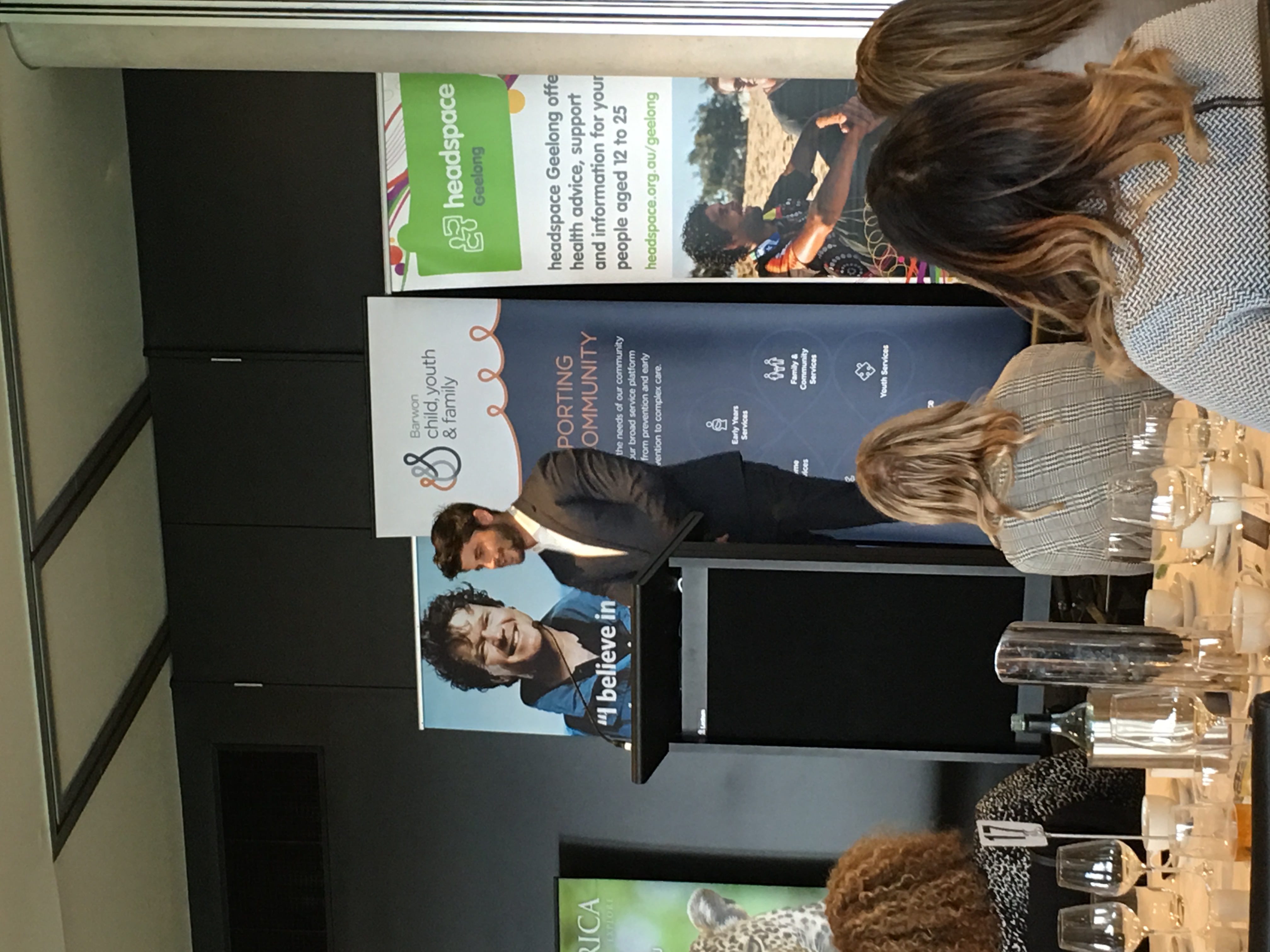 Nick Bracks speaking on stage