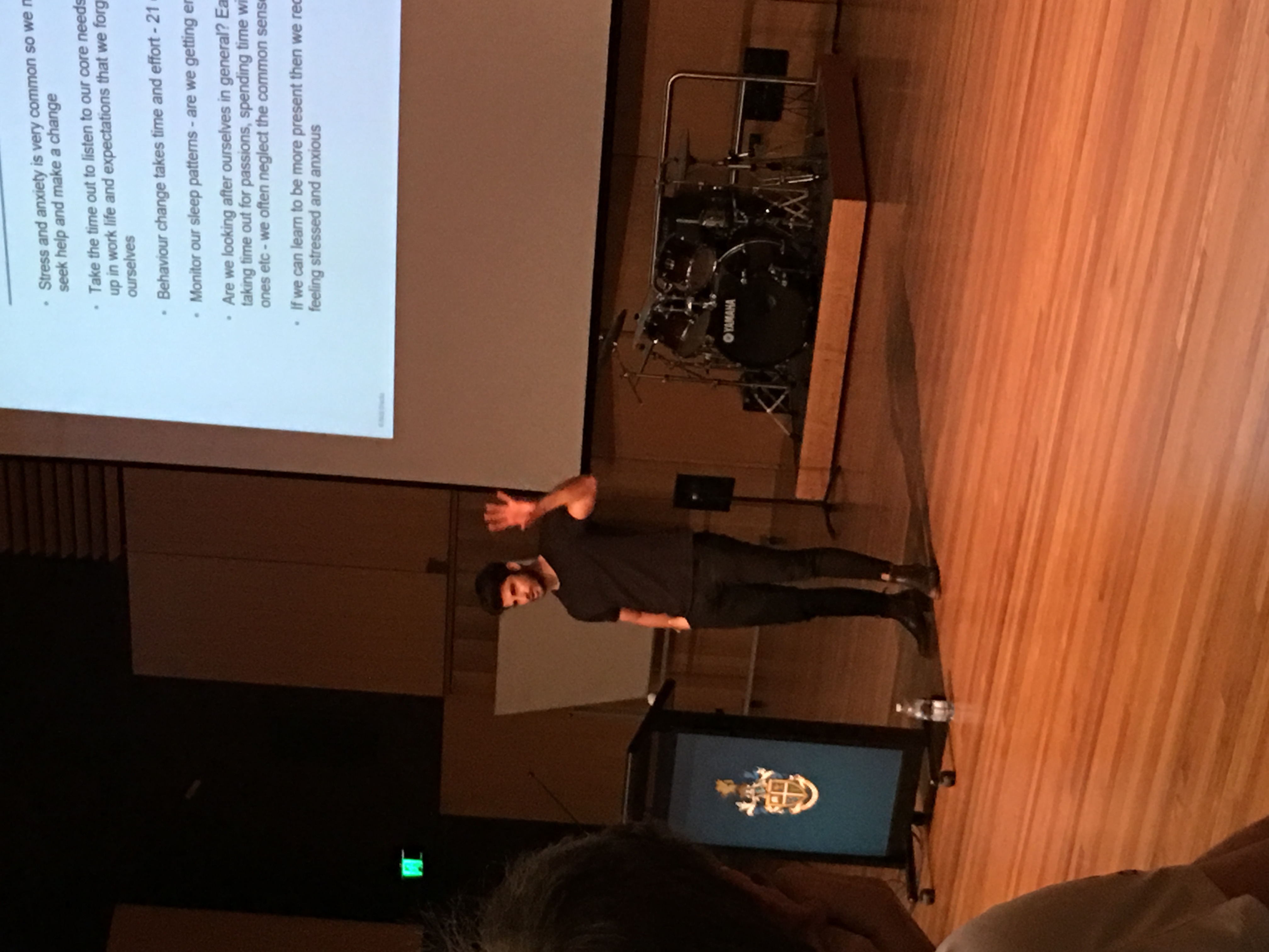 Nick Bracks speaking on stage