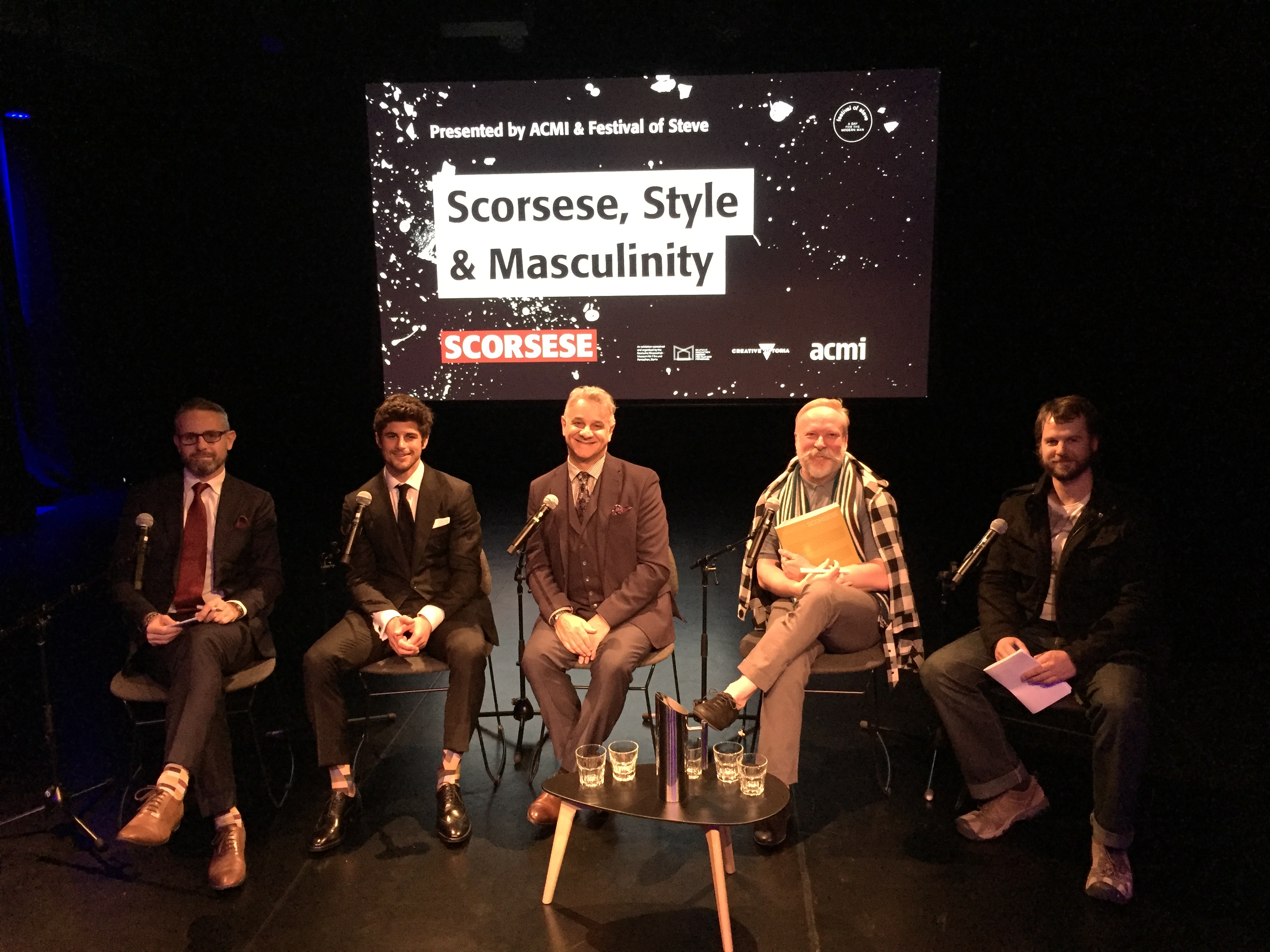 Nick Bracks speaking on stage