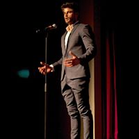 Nick Bracks speaking on stage