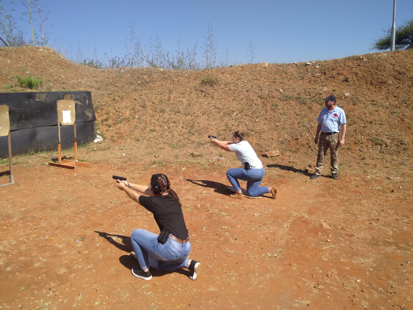 Group of security professionals participating in a firearm training session