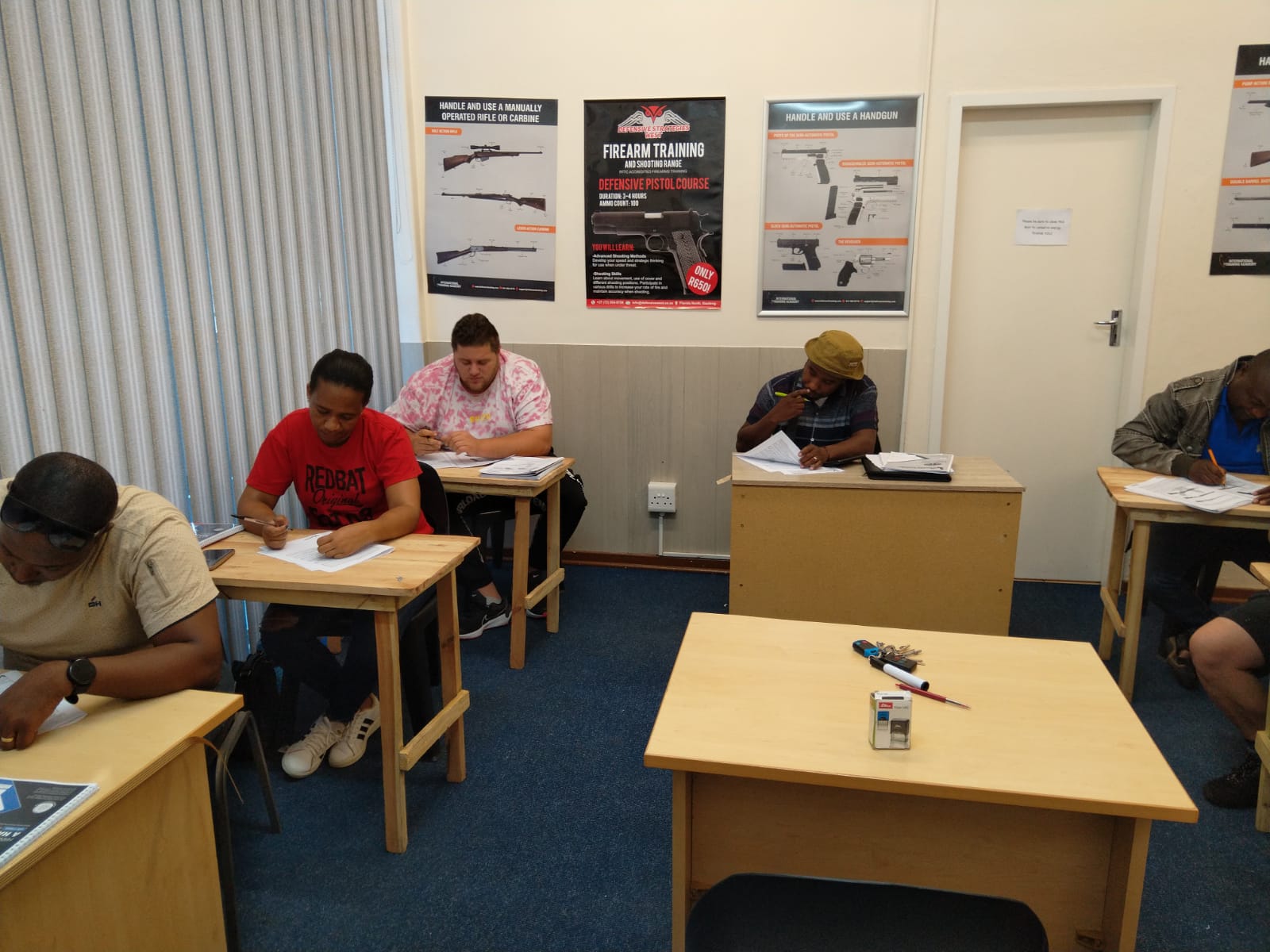 Professional security officers in a training classroom environment at Counter Strike
