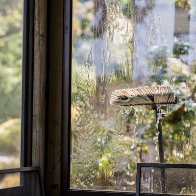 Window cleaning brush in action on residential window