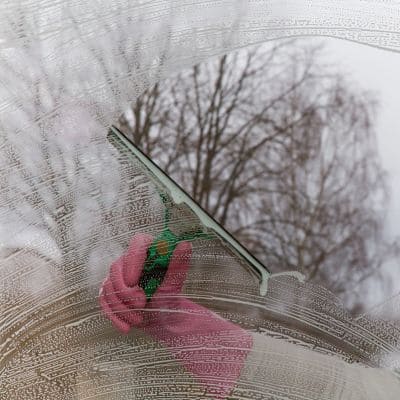 Window squeegee cleaning residential glass