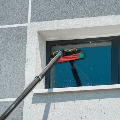 Commercial window cleaning with extendable brush