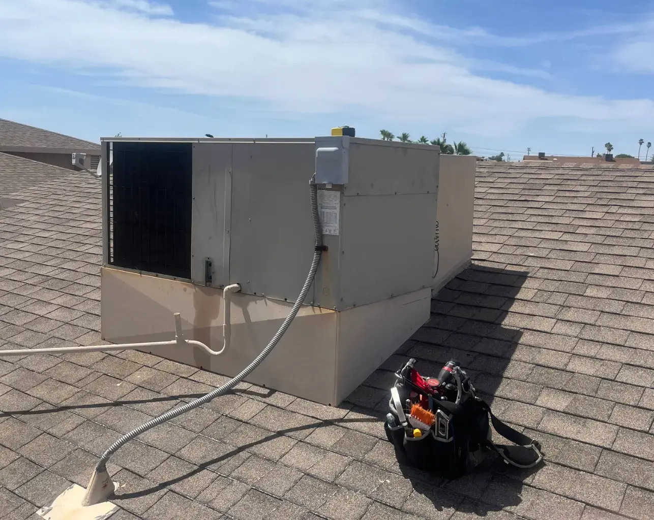 Rooftop packaged HVAC unit in full sun on a Lake Havasu City AZ home
