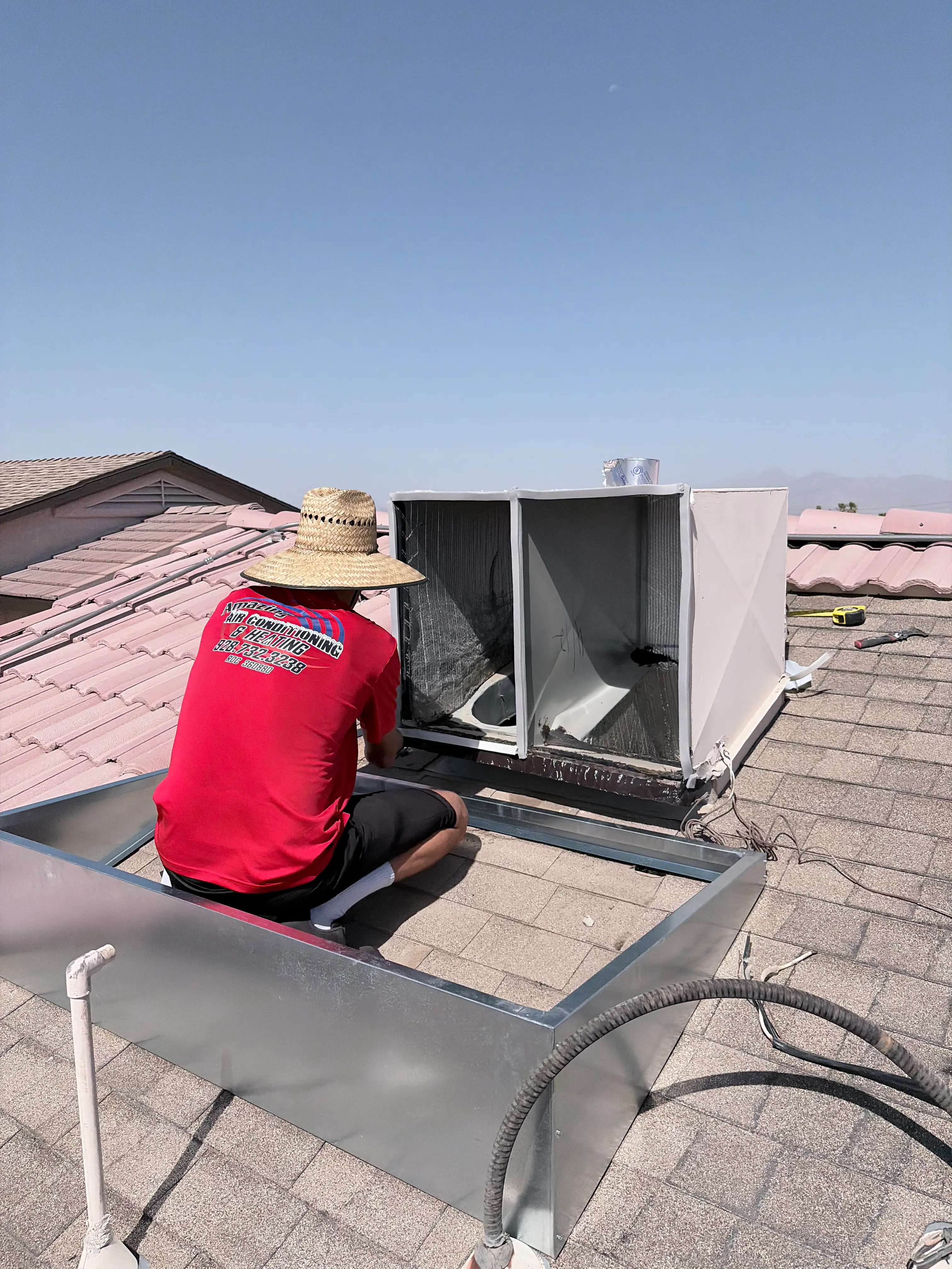 Barry Rae servicing a rooftop AC unit in Lake Havasu City AZ