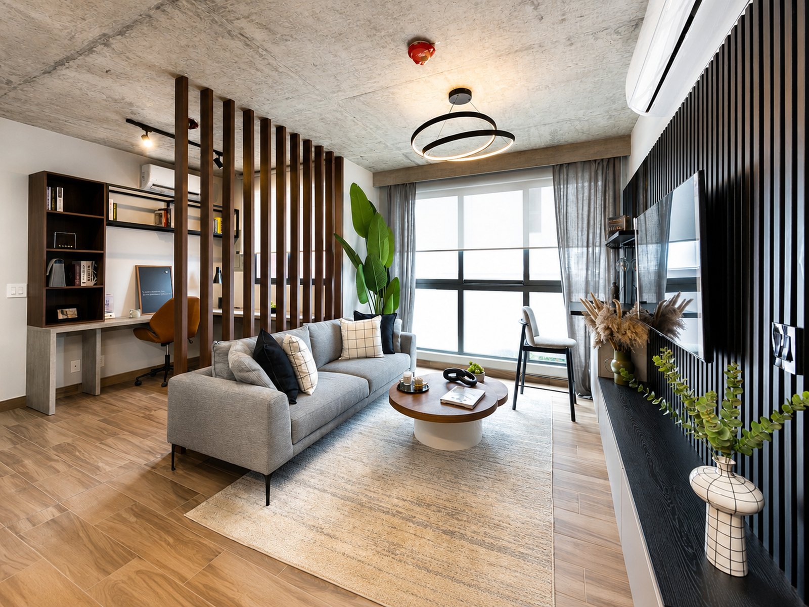 Sala y espacio de trabajo del apartamento modelo Cëntriqo