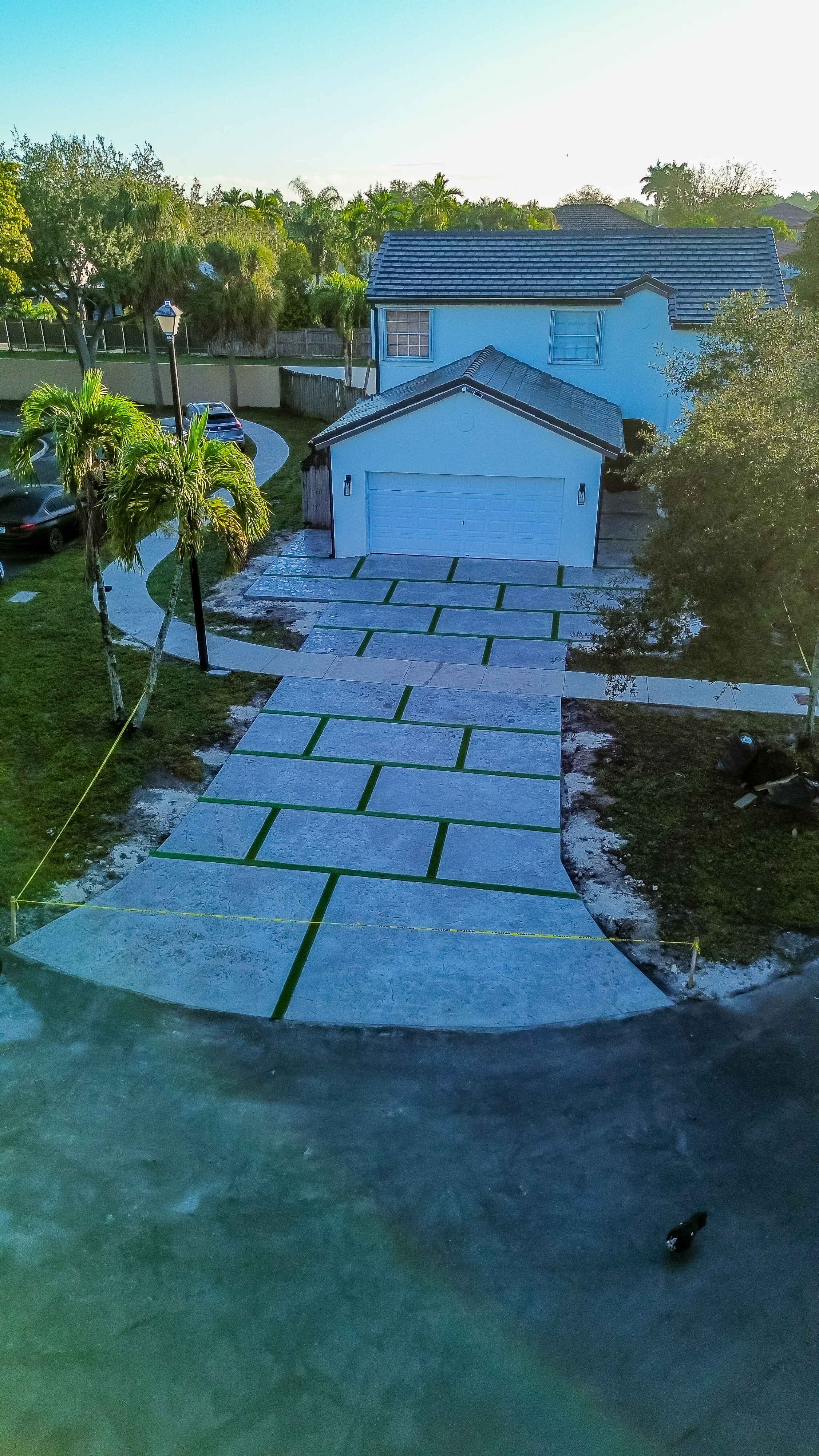 Wondering how much a concrete driveway costs in Miami-Dade in 2026? Learn real-world pricing, cost factors, permits, and what impacts your final investment.