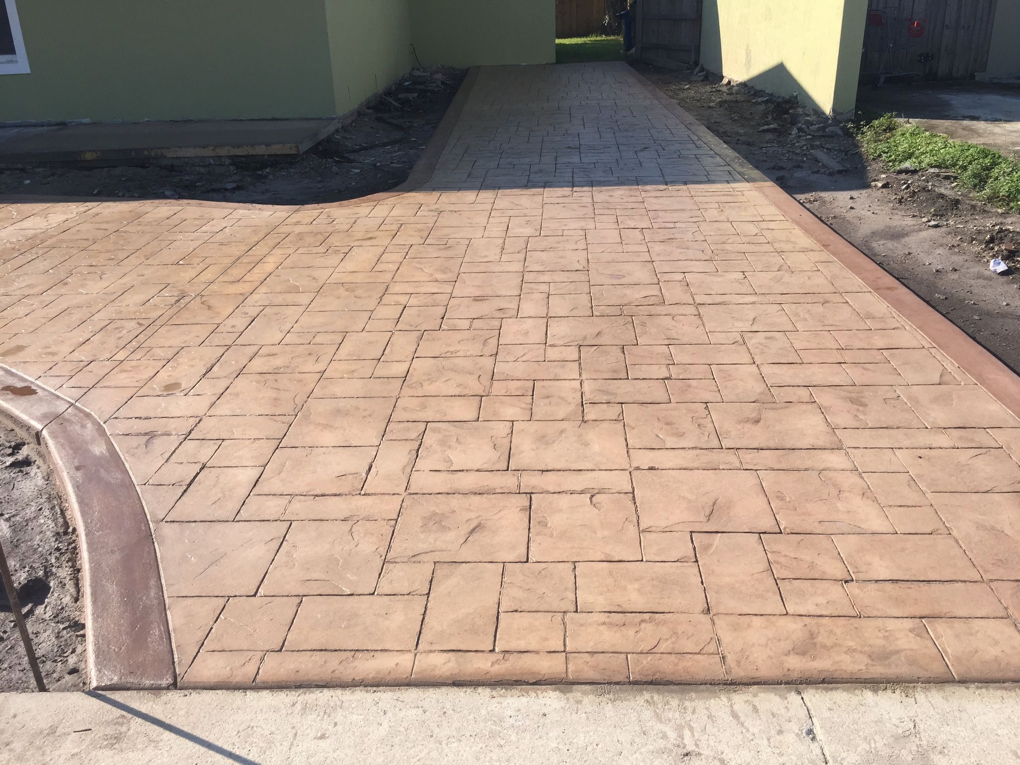 Stamped concrete or travertine? Compare cost, durability, maintenance, heat, and appearance to find the best patio material for your South Florida home.