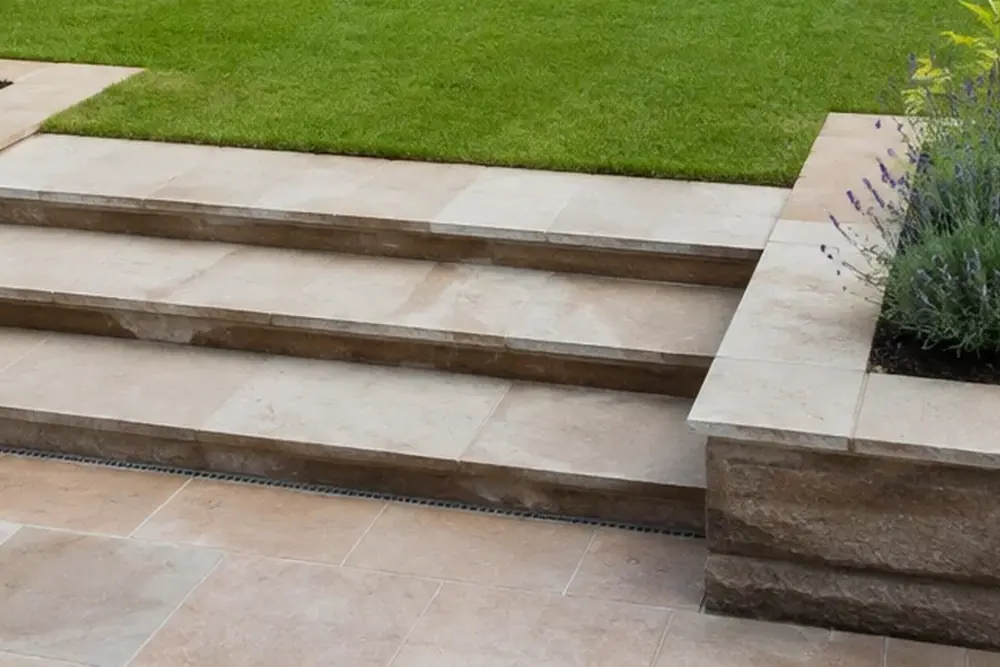 Natural stone patio within a complete landscaped garden