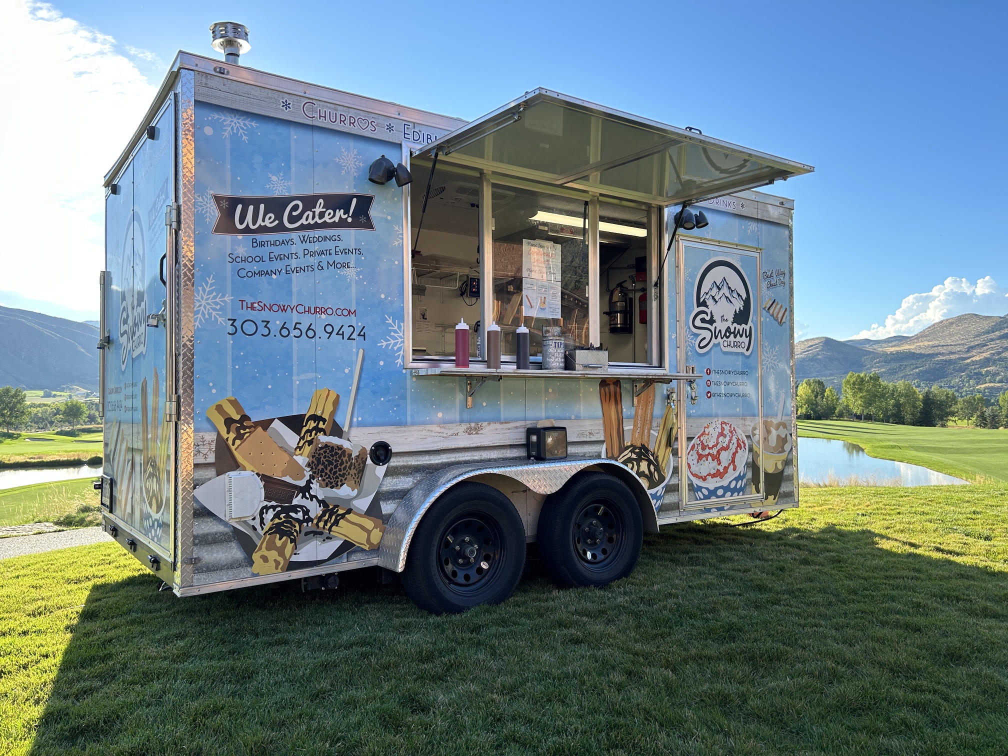 The Snowy Churro mobile trailer at an event