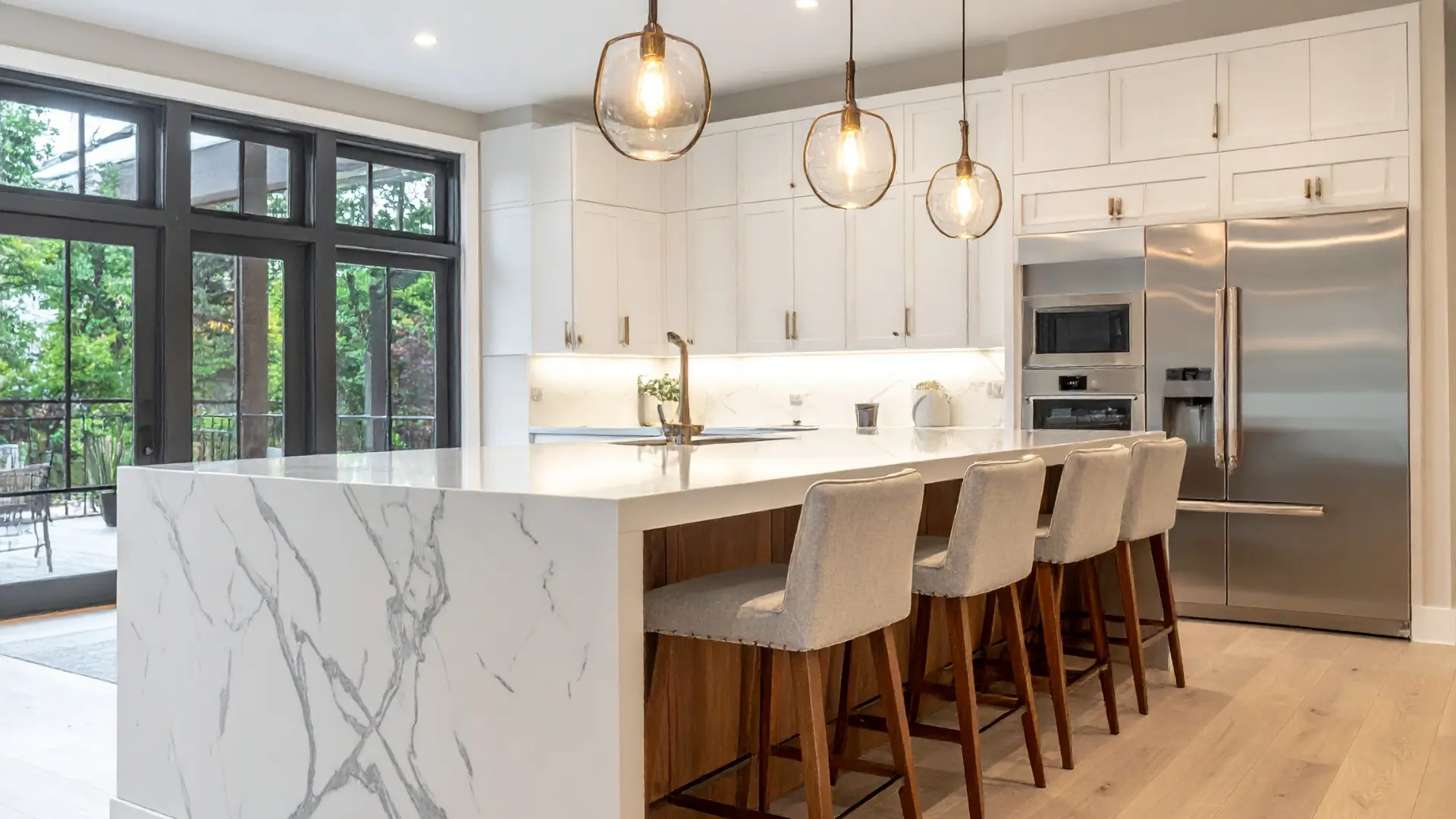 Modern kitchen remodel with marble waterfall island and white cabinets, Buffalo NY