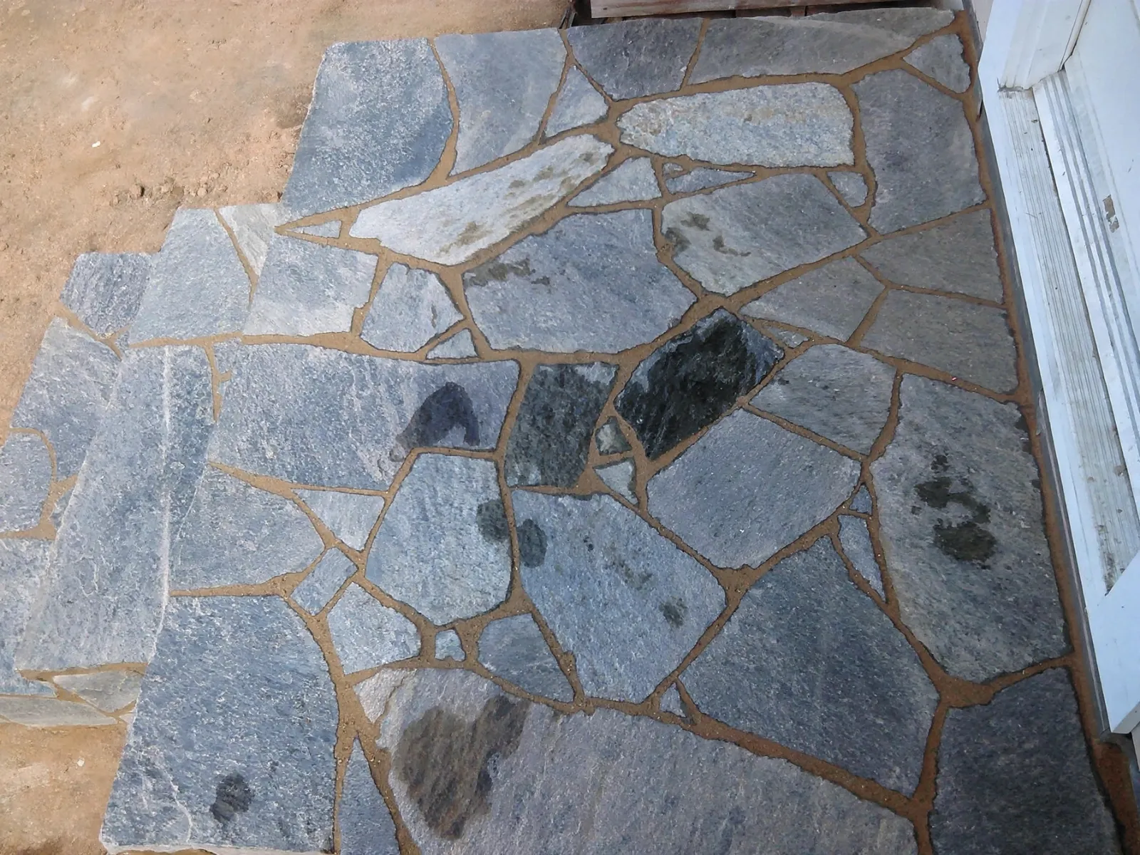 Top view of a porch landing laid in slate flagstone
