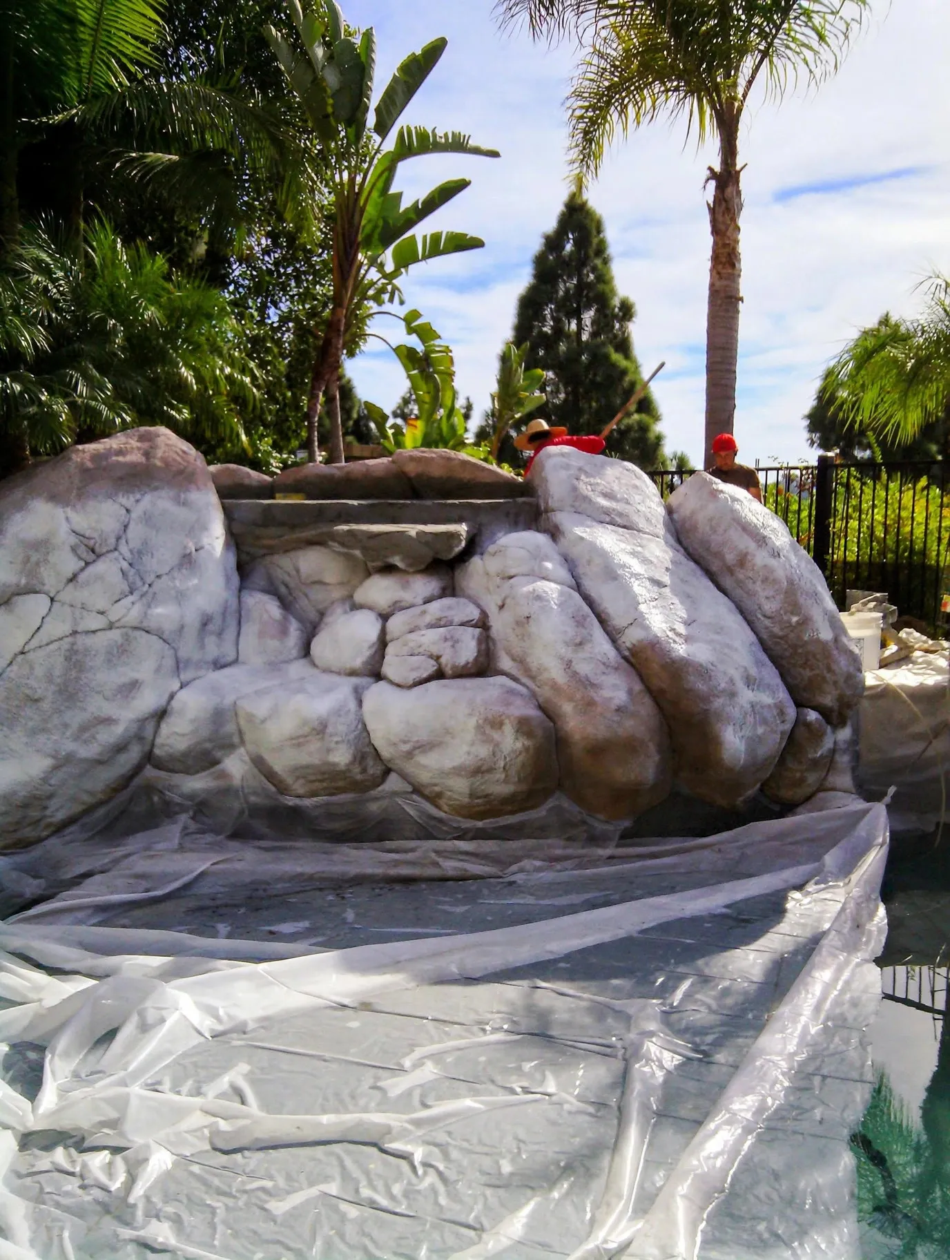 Faux boulders taking shape during construction, wrapped for curing