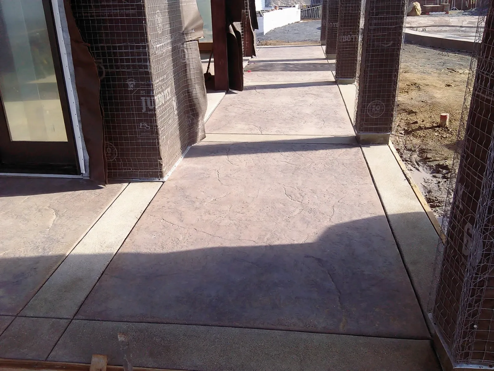 Stamped concrete breezeway between two buildings