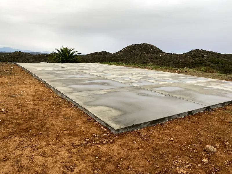 Large new concrete slab poured on a graded pad