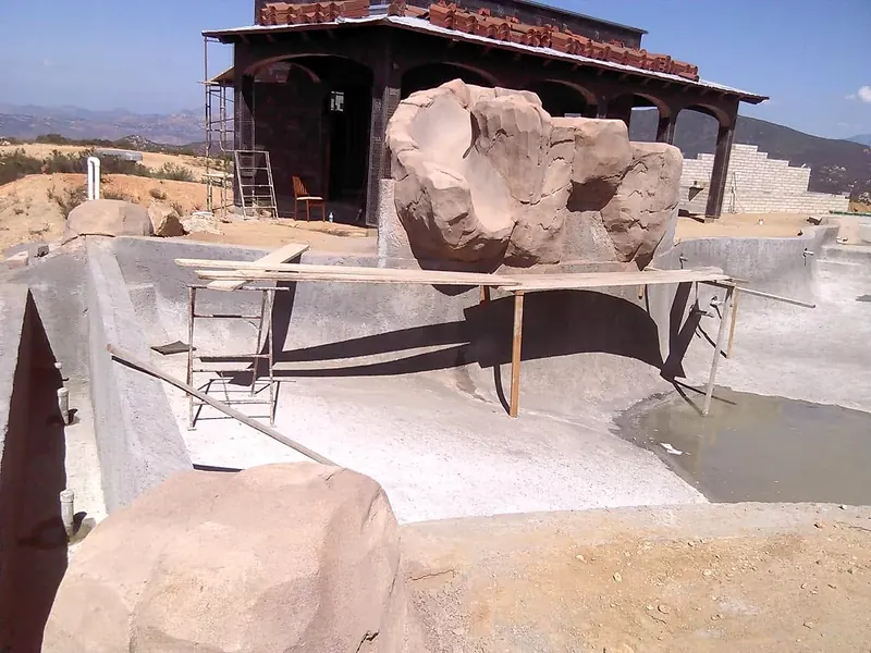 Faux rock slide built on a pool shell
