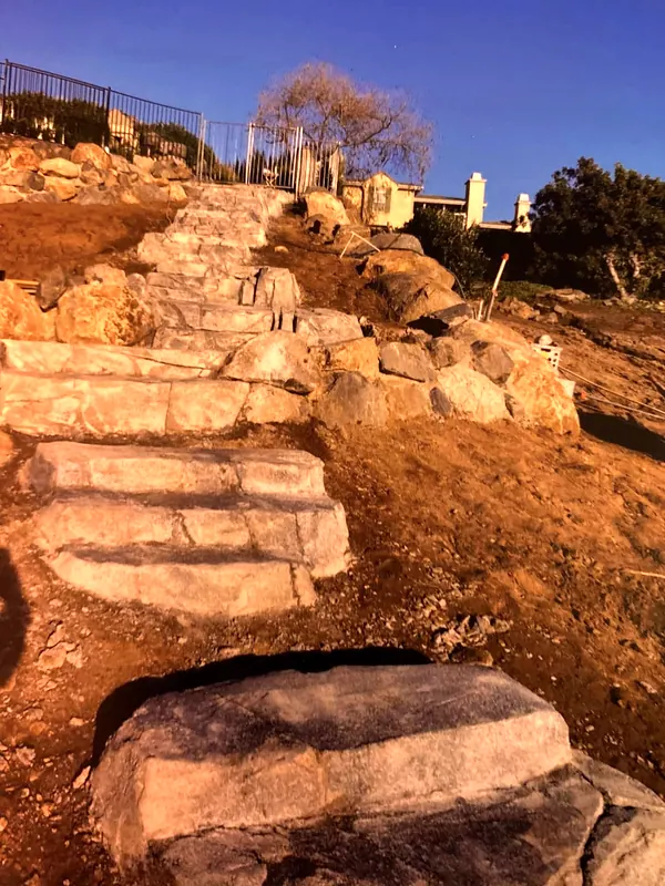 Hand-carved faux rock steps climbing a hillside
