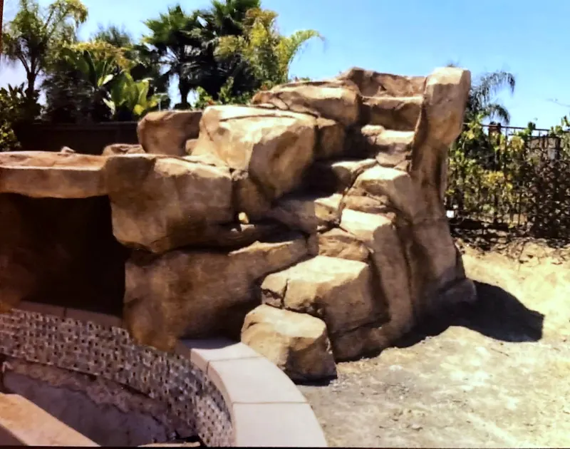 Faux rock waterfall structure before the pool is finished