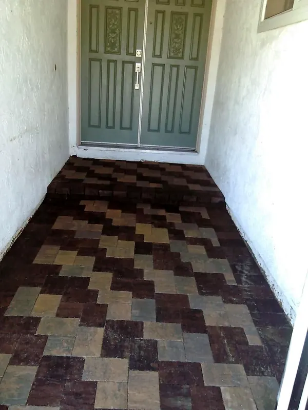 Multi-color paver landing at a front door