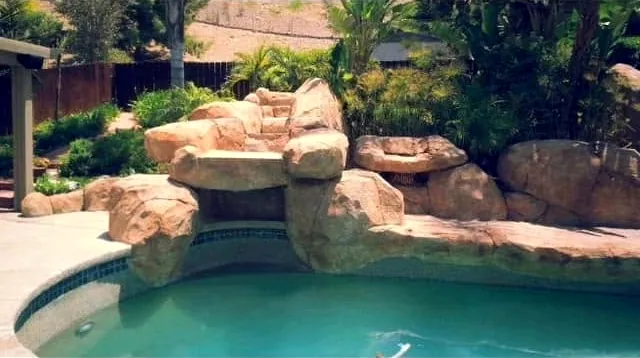 Finished faux rock waterfall on a pool