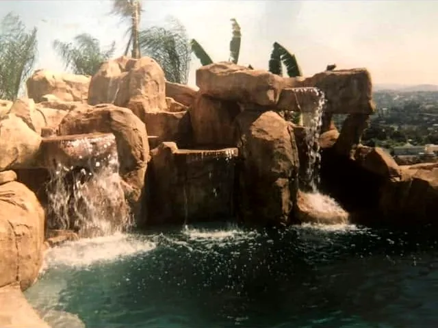 Faux rock waterfall running into a pool