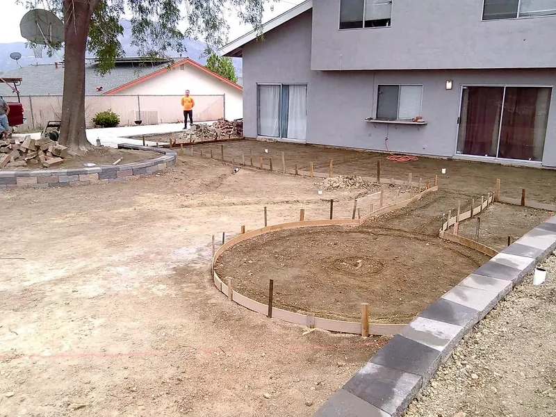 Forms set for a round patio and curved walkway