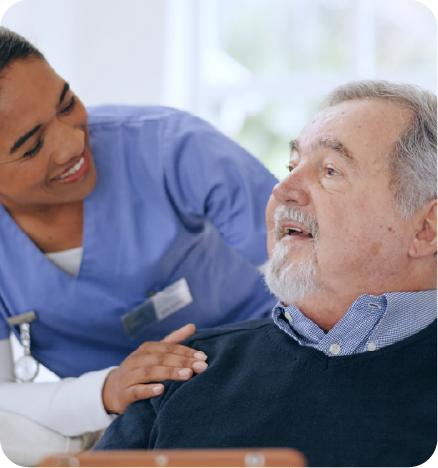 A colored female nurse checking an elderly white male