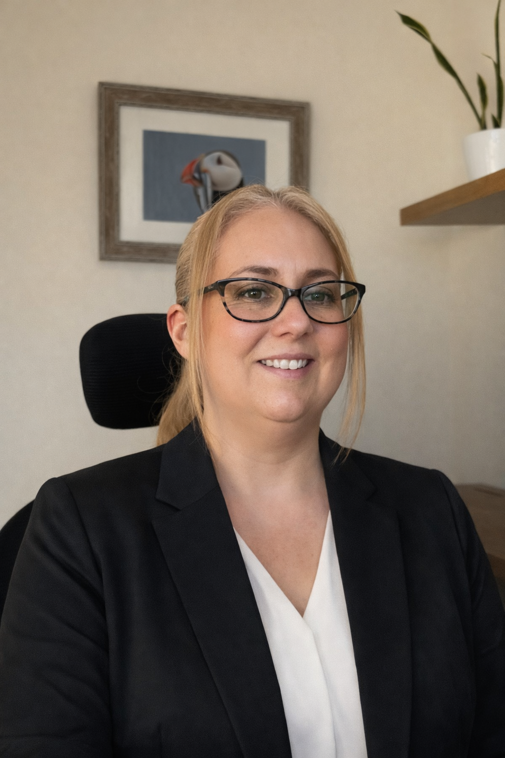 Hayley Willison, founder of The Efficient Penguin Co., in a professional office setting.