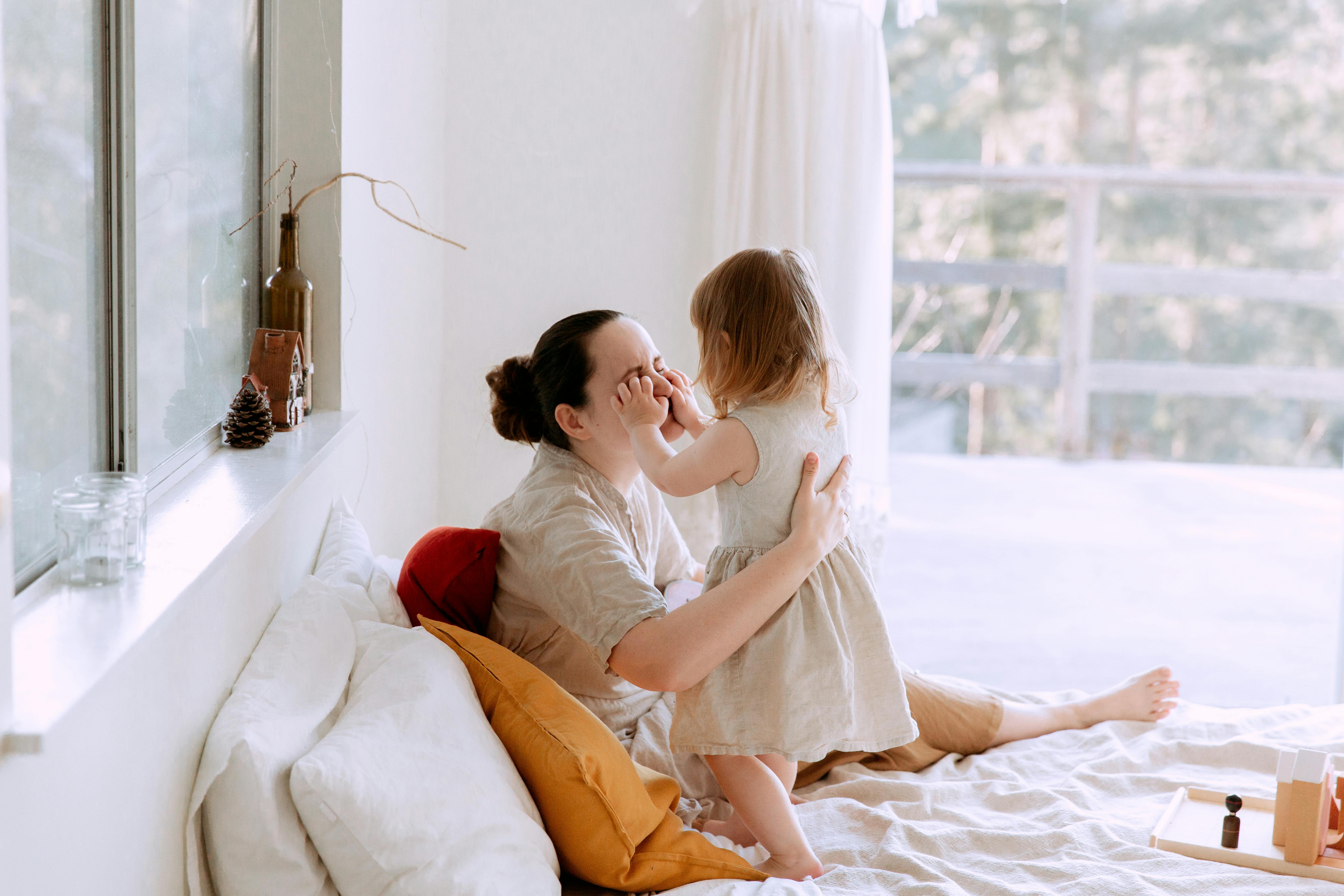 A mother present and connected with her young child on a relaxed morning, free from work demands. A mother present and connected with her young child on a relaxed morning, free from work demands.