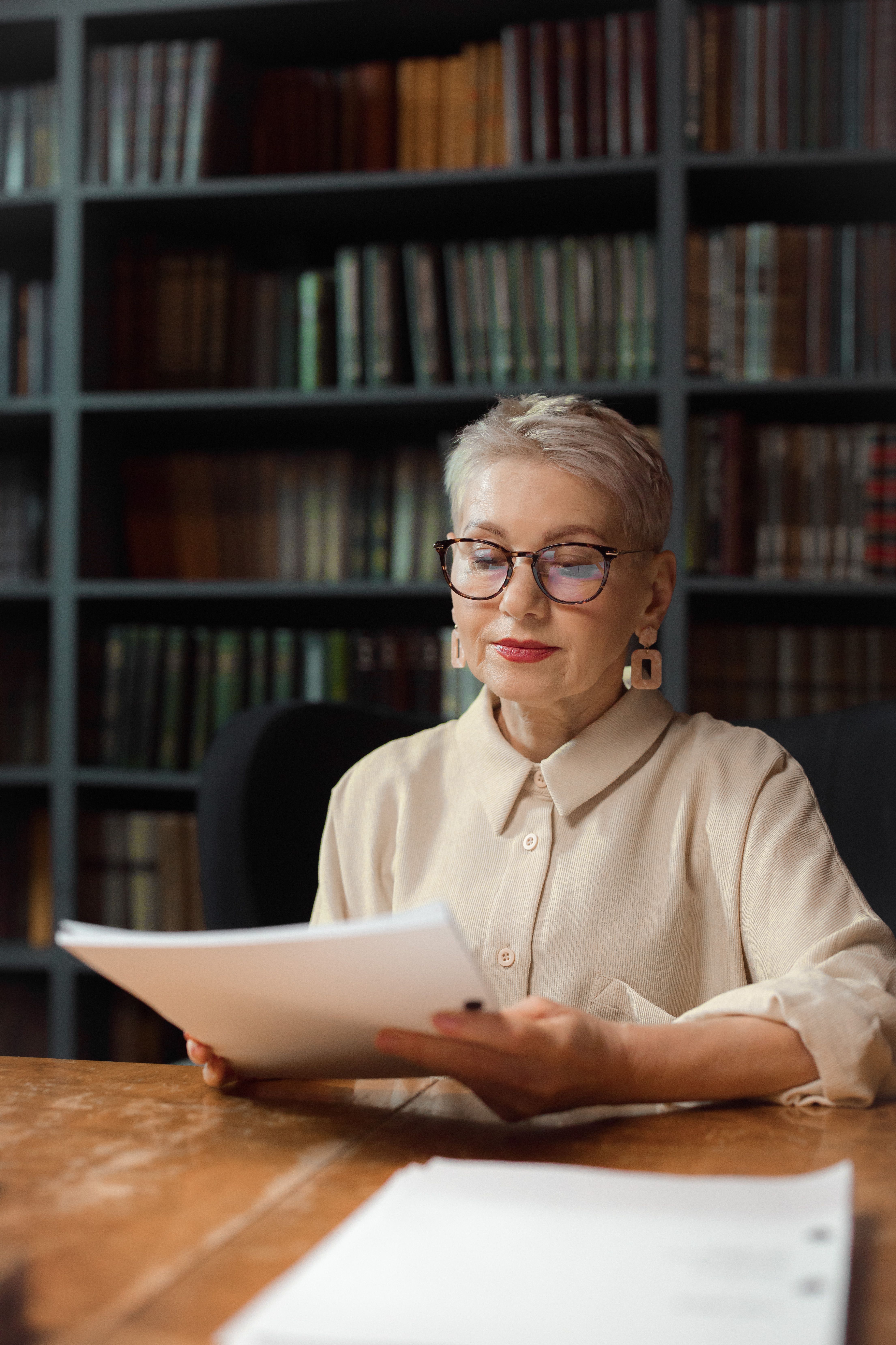 An established business owner reviewing documents with composed focus, representing the value of knowing specifically where your brand stands before making the next decision.