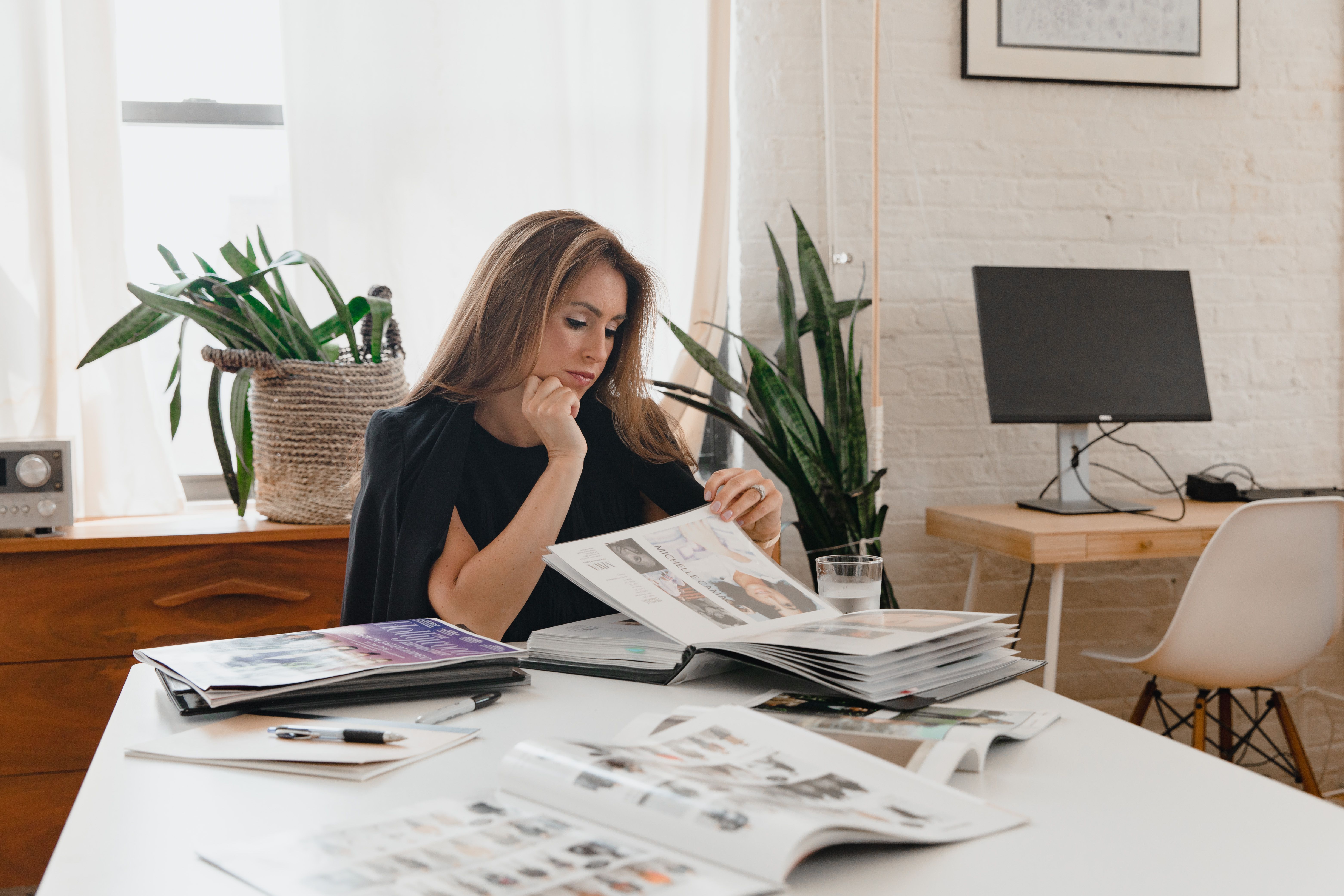 A business owner reading through materials with a considered expression, representing the quiet moment of realising that what was promised and what was delivered were two different things.
