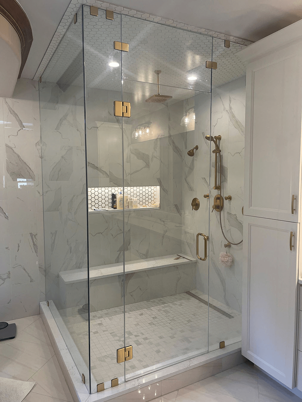 Frameless shower enclosure