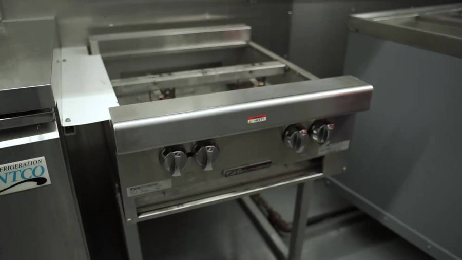 Stainless steel flat top inside a food truck