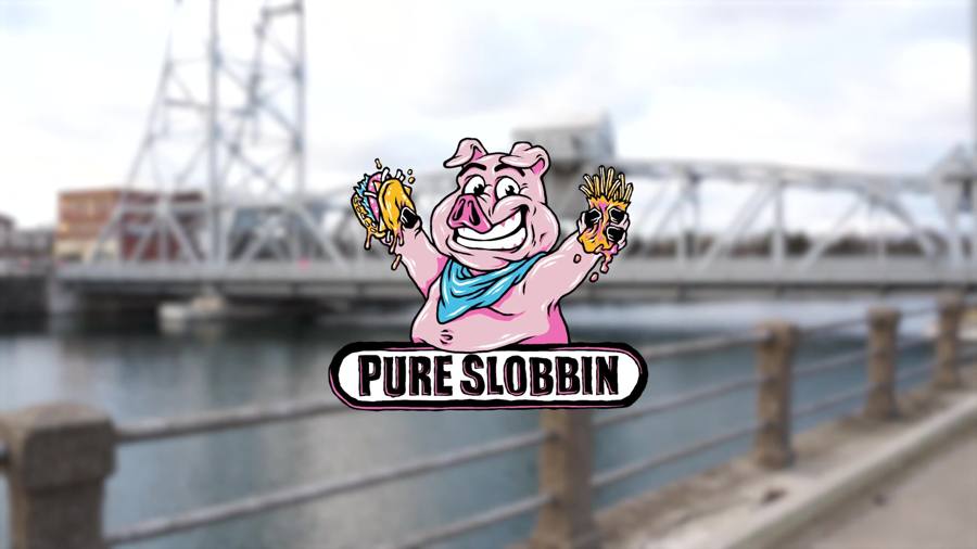 The Pure Slobbin' pig mascot holding a dripping burger and fries