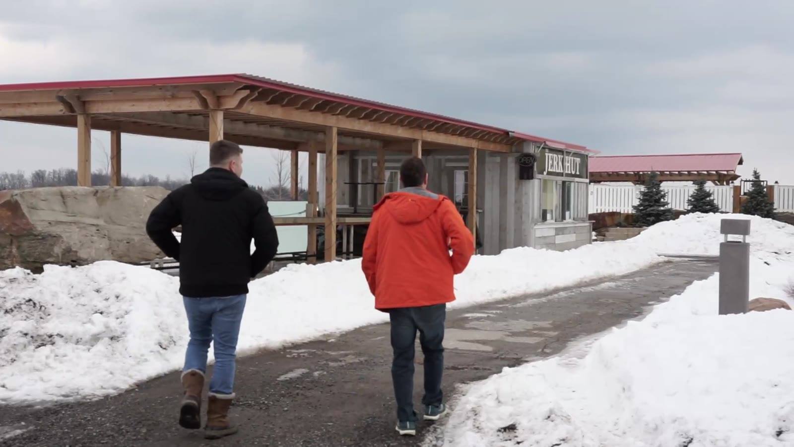 Joe walking up to a takeout restaurant in the snow