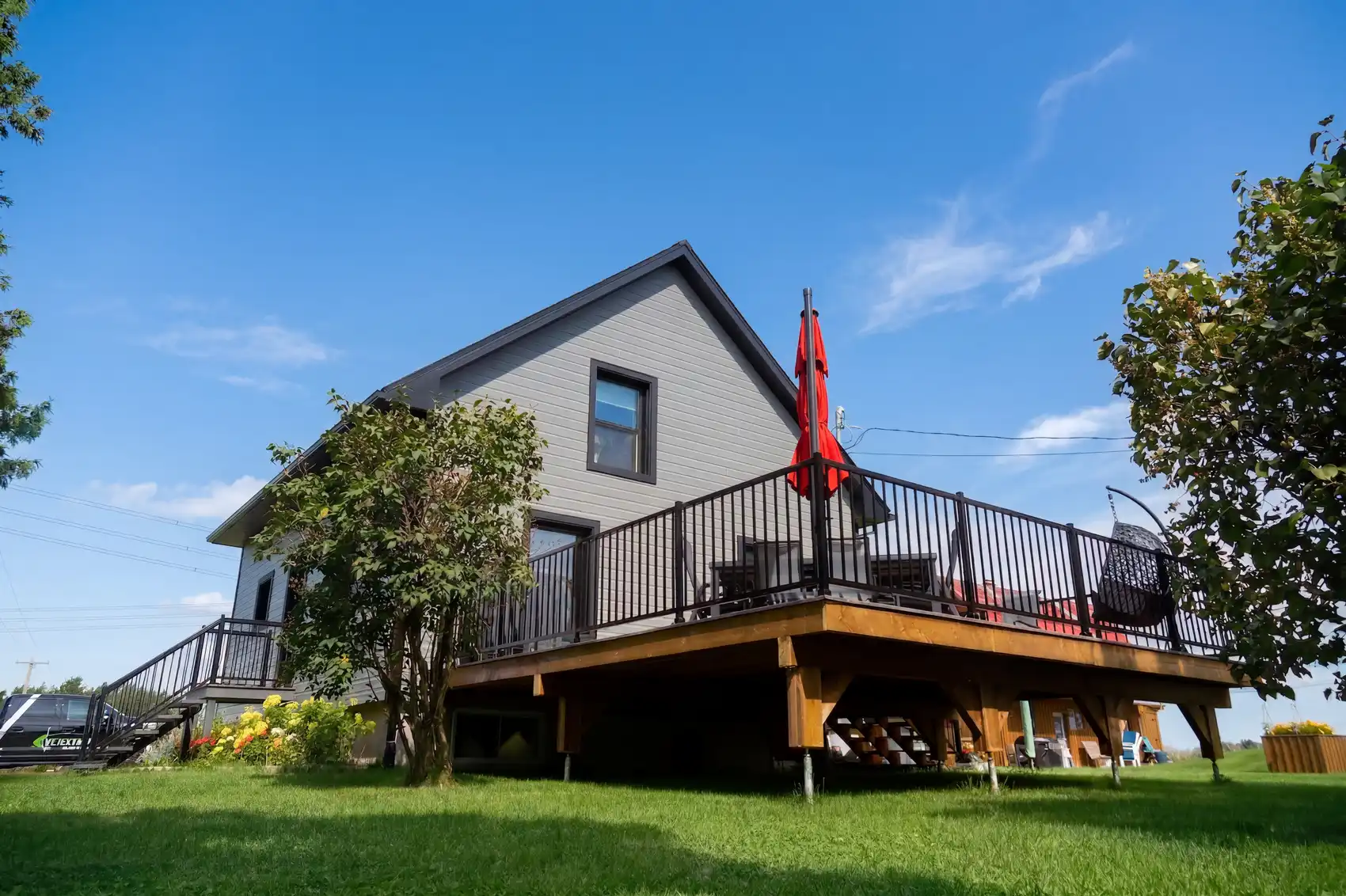 Modern wooden deck supported by Postech screw piles