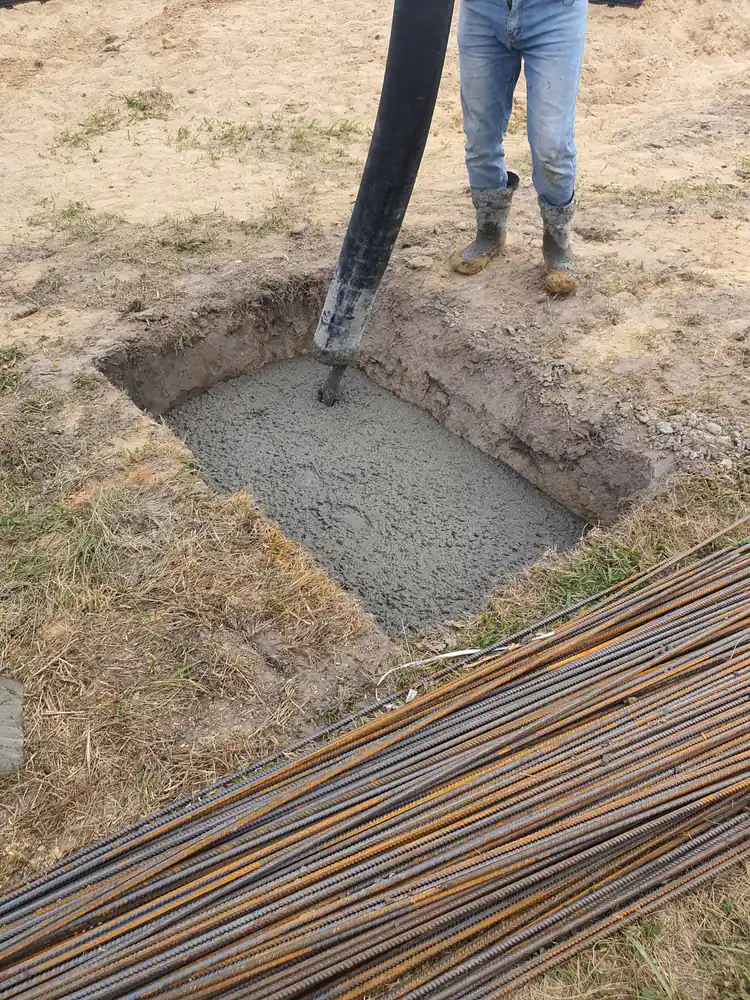 Concrete footing being poured for foundation work