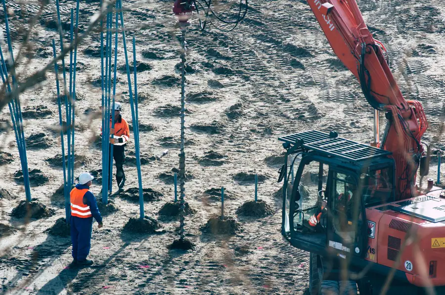 Excavation crew completing foundation site work